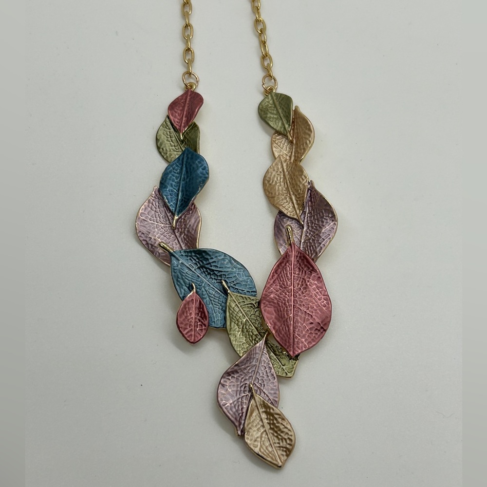 Gold metal chain with metal leaves in cluster